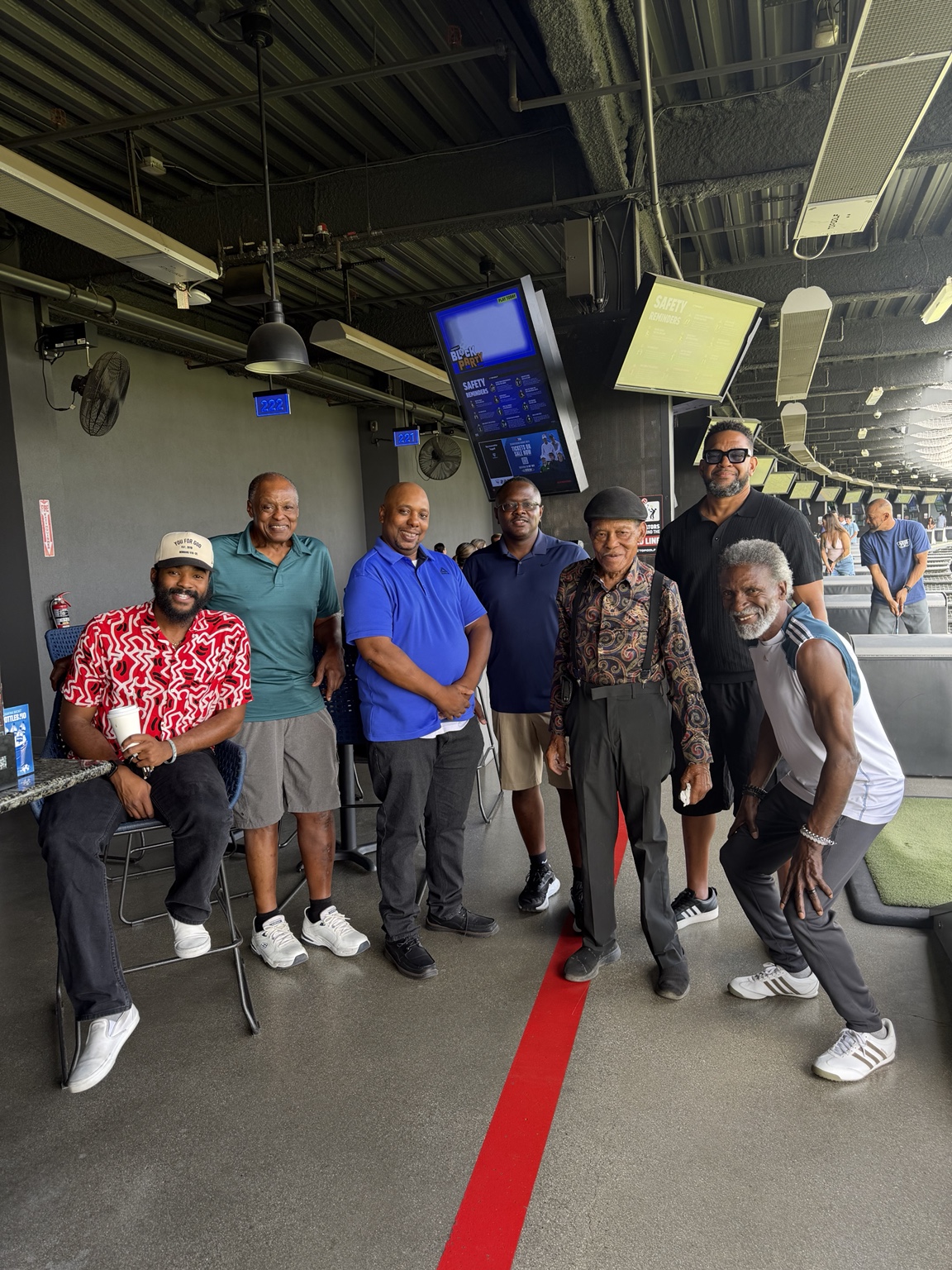 Members and friends of Fountain of Life Temple gathering together at Topgolf.